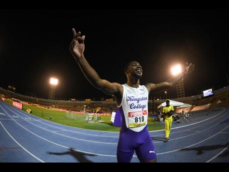Kingston College’s (KC) Bouwahjgie Nkrumie celebrates after winning the Class One boys’ 100 metres final at the ISSA/GraceKennedy Boys and Girls’ Athletics Championships at the National Stadium last night. Nkrumie became the first Jamaican schoolboy to clock under 10 seconds for the event, when he recorded 9.99 to establish a new record.