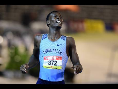 Credit: Kenyon Hemans Edwin Allen High’s Delano Kennedy is elated after winning the Class One boys’ 400 metres at the ISSA/GraceKennedy Boys and Girls’ Athletics Championships at the National Stadium last night. Kennedy clocked 45.27 for the victory.