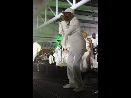 Veteran crooner Beres Hammond clutches his microphone closely as he gives it his all.