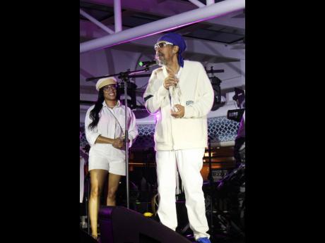 Third World co-founder and musician Cat Coore gives a dynamic acceptance and thank you speech as Ronnie Tomlinson, public relations and communications manager, looks on quite pleased. Third World received an honorary 50th anniversary award from the organisers of the 2023 Love and Harmony Cruise.