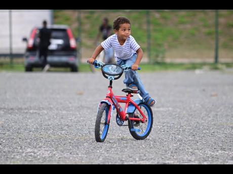 Future freestyle BMX champion in the making? Three-year-old Luca Onfroy shows off his skills in the general area at Jamaica Stunt Fest held at the National Stadium on Saturday.