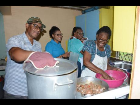 Sonia Clarke (right), member of the Balaclava Senior Citizens’ Club in St Elizabeth and wife of former agriculture minister, the late Roger Clarke, is busy preparing meals for the elderly, shut-ins and the indigents in the town and neighbouring communities as part of the club’s outreach initiative. She is joined by club members Keith Johnson (left) and Yvonne Nesbeth (second right), as well as the  National Council for Senior Citizens Parish Organiser, Marieck Hendricks-Morgan.

 