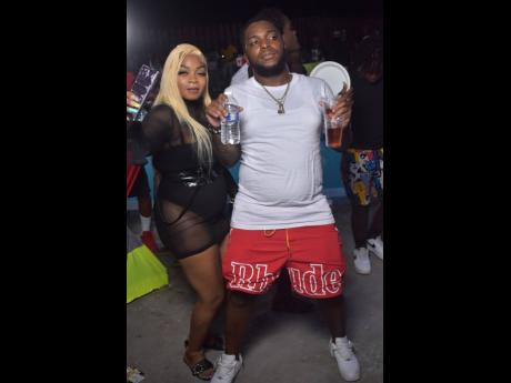 Disc jock Javvy Supreme (right) and Chin were at the poolside.