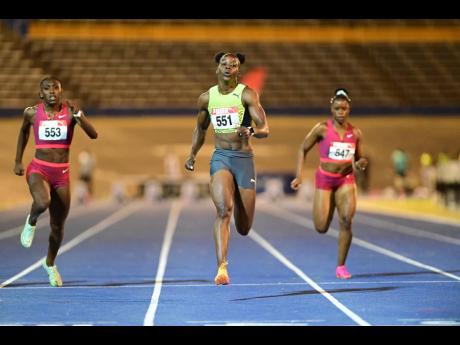 Shericka Jackson (centre) wins the women’s 100 metres A final at Velocity Fest 13 held at the National Stadium last Saturday.  Jackson clocked a meet record and world lead  10.82 seconds.