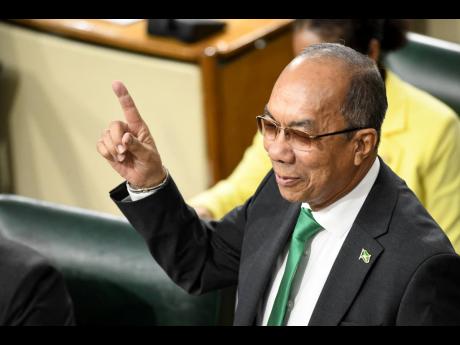 National Security Minister Dr Horace Chang presenting in the Sectoral Debate in the House of Representatives yesterday.