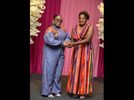 Shamara Sahadeo (left) receives her Distinguished Award for Fashion from Dr Jacqueline Chambers, medical director at I-Doc Concierge Wellness Services.