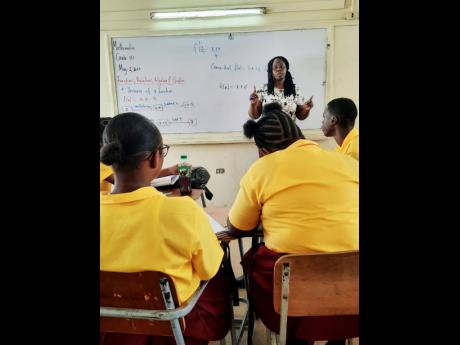Dawkins conducts a grade 10 class.
