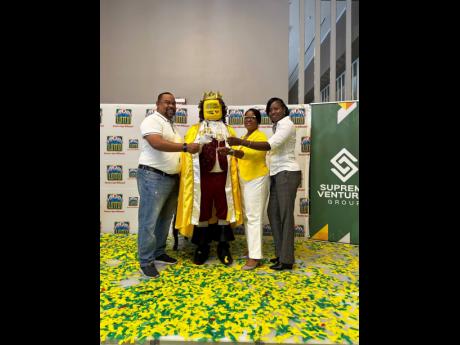 Credit: Kenrick Morgan Cheers to the king! Super Lotto winner A. Fraser (second left), toasts his success with (from left) Supreme Ventures’ Limited Executive Chair Gary Peart, International Game Technology General Manager Debbie Green, and representative from the Betting Gaming and Lotteries Commission Kareen White.
