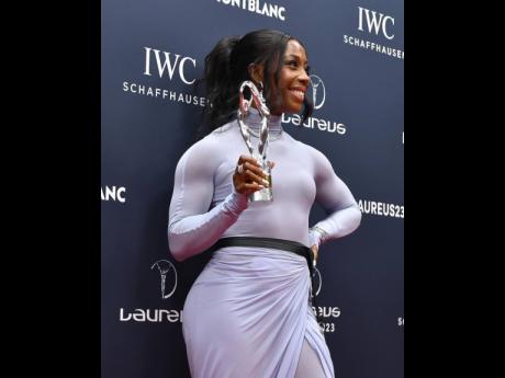 Shelly-Ann Fraser-Pryce holds the Laureus Sports Woman of the Year award after the presentation in Paris yesterday.