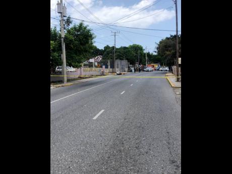 Credit: André Williams Investigators on the scene of Wednesday’s shooting outside a funeral on Maxfield Avenue in Kingston. One man was injured.