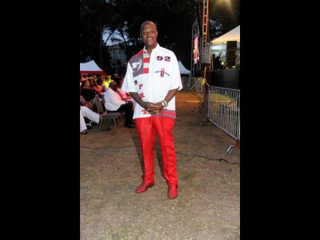 There was no discounting Junior Sinclair’s commitment to wearing red. The owner of Sinclair’s Discount Centre paired his red pants with red shoes. 