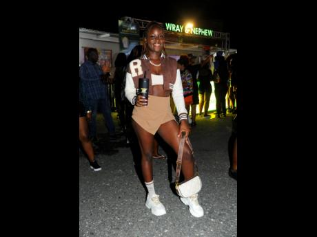 Credit: Nicholas Nunes Brown never goes out of fashion, and Shadeana Mascull rocks the colour in a letterman jacket.
