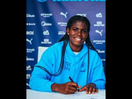 Reggae Girlz’ and Mancheter City’s Khadija Shaw puts pen to paper on a new contract.