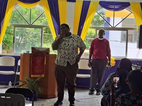 Joshua Moore, son of late deputy commissioner of corrections Reverend Orville Moore, testifies during yesterday’s worship service at the Santa Cruz Holiness Christian Church in St Elizabeth.