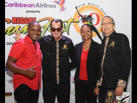 From Left: Kamal Powell, regional marketing manager, Magnum Tonic Wine; Joe Bogdanovich, CEO of Downsound Entertainment, Marlene Malahoo Forte, minister of legal and constitutional affairs; and Robert Russell, deputy chairman, Reggae Sumfest pose for the camera at the launch. 