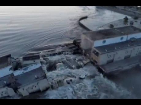 This image made from video provided by Ukraine’s Presidential Office shows the damaged Kakhovka dam near Kherson, Ukraine, on Tuesday. 