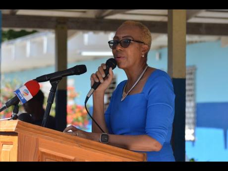 Fayval Williams, minister of education and youth, makes an emotional plea to anyone with information to come forward.