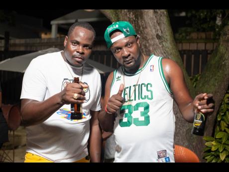 DJ Jah Jah Blacks (left) and DJ John Crow take a pic after earning their spot in the Guinness Sounds of Greatness 2023 grand finale.