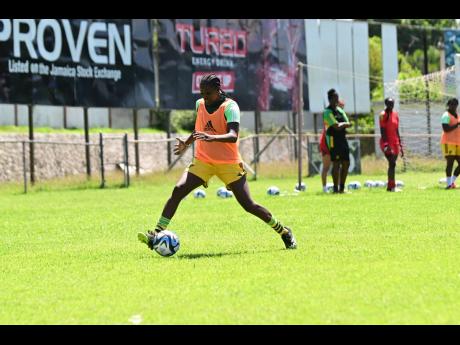 Reggae Girlz’ former captain Konya Plummer dribbles the ball during a training session at the Anthony Spaulding Sports Complex on Wednesday.