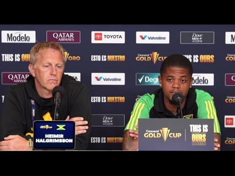 Reggae Boyz head coach Heimir Hallgrimsson (left) and Leon Bailey speak to the media yesterday ahead of their Gold Cup Group ‘A’ encounter against Trinidad & Tobago today.