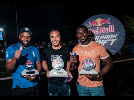 Nicholas ‘Tazz’ Barnes (centre), the 2022 Red Bull Car Park Drift champion, is joined by first runner-up Cleve ‘Cutta Hype’ Ottey (left), and second runner-up Sheldon ‘Z Boss’ Johnson.