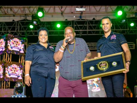 Guinness Brand Manager Nadine Hylton (left) and Guinness Junior Brand Manager Ben Sinclair (right) presented veteran DJ Sky Juice (centre) with his Guinness Sounds of Greatness Recognition Award.