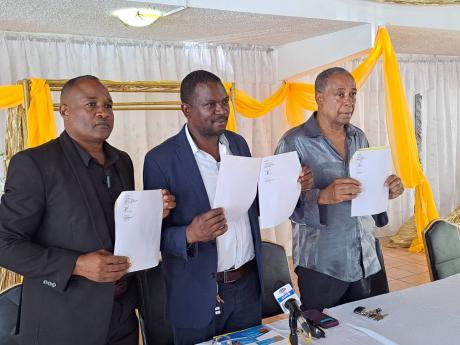 The three councillors from Westmoreland Western, showing their official letters of resignation, (from left) Ian Myles, Little London division; Garfield James, Sheffield division, and Lawton McKenzie, Grange Hill division.