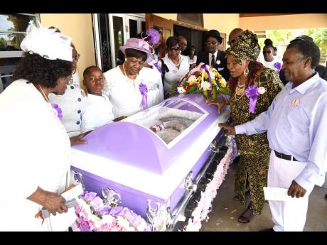 Family members and friends view the body of Gladys Maud Richards at the Clear Park Seventh-day Adventist Church in Gordon Pen, St Catherine, on Wednesday.