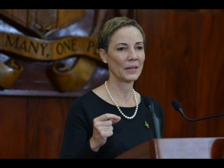 Minister of Foreign Affairs and Foreign Trade, Senator Kamina Johnson Smith speaks at yesterday’s post-Cabinet press briefing at Jamaica House, St Andrew.