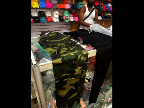 Credit: Tiffany Pryce Vendors in downtown Kingston say that camouflage and joggers are a hit this summer.