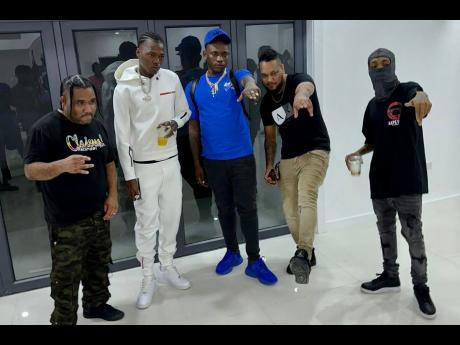 Credit: Contributed Saluting their collaboration are (from left) Gutty Bling, Skillibeng, Valiant, Digi Doran and Kraff.