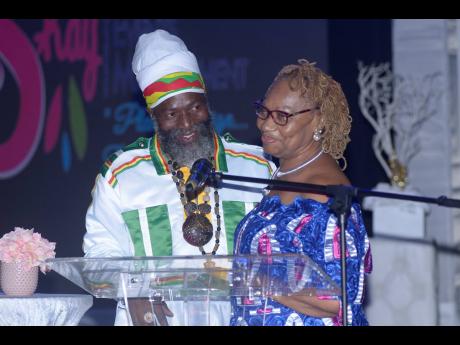 Capleton congratulates Kemp as she received her Queens Of Reggae Island Honorary Ceremonies Award in 2019.