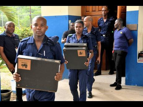 Jamaica Constabulary Force (JCF) recruits carry several of the computers, valued at US$700,000, that were acquired under the Ministry of National Security’s Security Strengthening Project with Inter-American Development Bank funding support. The computers were handed over during a ceremony at the National Police College of Jamaica in St Catherine on Wednesday.

 