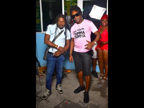  Presidential (left), formerly of Monster Shack crew, chills with ‘90s singer Jus Chris.