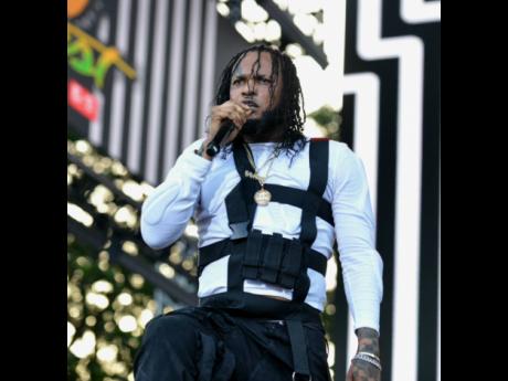 Tommy Lee Sparta getting the crowd hyped at Reggae Sumfest. 