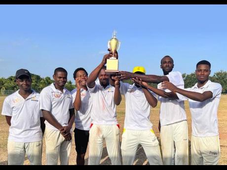 Credit: Contributed Bridgeport captain Dwayne Guthrie (centre) celebrates with teammates after securing the JEP 40-over St Catherine cricket title after a two-wicket win over Bridgeport in the final at Port Esquivel on Sunday.