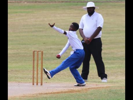 St. Mary leg spinner Shavaughn Boyd about to send down another delivery during the Kingston Wharves U15 Championship match against St Ann at the Ultimate Oval in Discovery Bay yesterday.