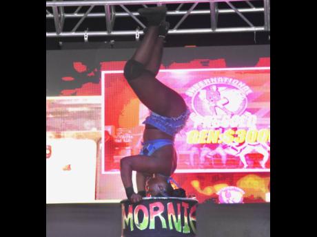 Credit: Ashley Anguin Henry shows her balance and flexibility, which helped her take the title.