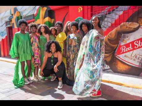 Award-winning celebrity hairstylist and fashion designer, Neahlis (centre) showcased her collection with the help of stunning models at the ‘Fashion Ova Style’ Kingston Creative Artwalk.