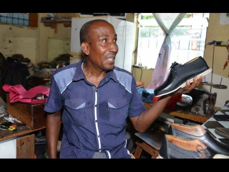 Davis, who calls himself the ‘Leather Master’, shows off one of the popular orders.