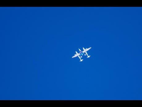 Virgin Galactic's mothership Eve, carrying the rocket-powered plane Unity 22, flies after taking off from Spaceport America, near Truth or Consequences, N.M., Thursday, Aug. 10, 2023. Virgin Galactic is taking its first space tourists on a long-delayed rocket ship ride. (AP Photo/Andrés Leighton)