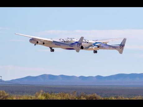 Virgin Galactic's mothership Eve, carrying the rocket-powered plane Unity 22, takes off from Spaceport America, near Truth or Consequences, N.M., Thursday, Aug. 10, 2023. Virgin Galactic is taking its first space tourists on a long-delayed rocket ship ride. (AP Photo/Andrés Leighton)