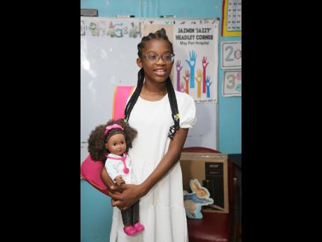 Jazmin ‘Jazzy J’ Headly, a 10-year-old Canadian actress of Jamaican parentage, at the May Pen Hospital in Clarendon where she donated items for the setting up of the ‘Jazmin Corner’ on the paediatric ward on Friday. 