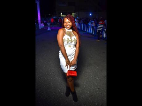 This gorgeous woman beams at Tommy ‘Brite Lite’ Thompson’s 55th birthday extravaganza, held recently at Sabina Park in Kingston.