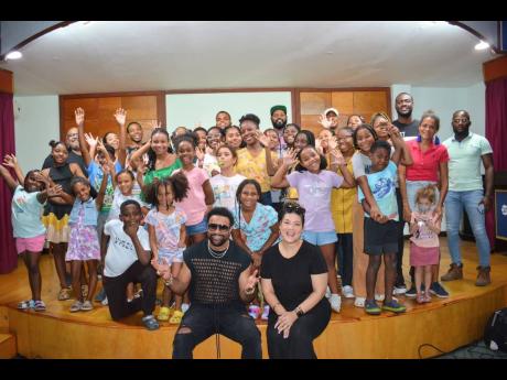 Credit: Contributed Renowned entertainers Orville ‘Shaggy’ Burrell and Tessanne Chin are surrounded by participants in Chin’s Voice Box Summer Singing Intensive.