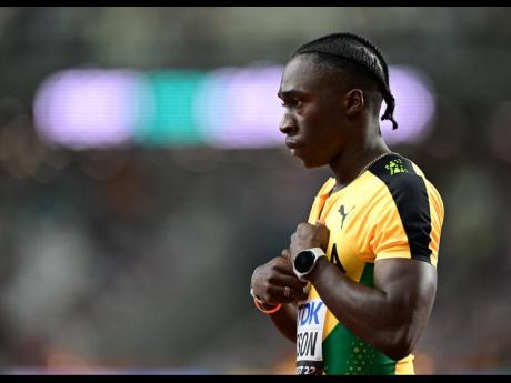 Credit: Gladstone Taylor Jamaica's Rohan Watson contemplates after finishing second in his men's 100 metres heat at the World Championships in Budapest, Hungary today.