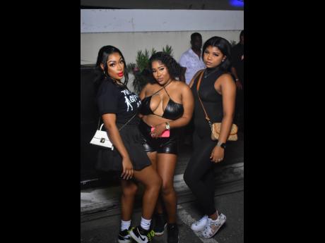 Credit: Anthony Minott Three the hard way! From left Tonii, Liya and Shadz share lens time at Pon Di Plaza.