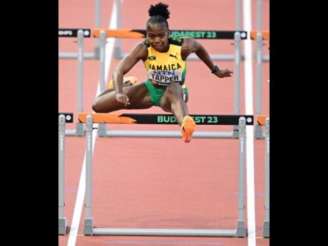 Gladstone Taylor/Multimedia Photo Editor
Jamaica’s Megan Tapper competing in heat five of the women’s 100m hurdles event at the  World Athletics Championships in Budapest, Hungary yesterday. Tapper placed second in 12.51 seconds. The heat was won by Nigeria’s Tobi Amusan in 12.48.