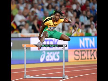 Jamaica’s Roshawn Clarke clears a hurdle on his way to finishing fourth in the men’s 400 metres hurdles.