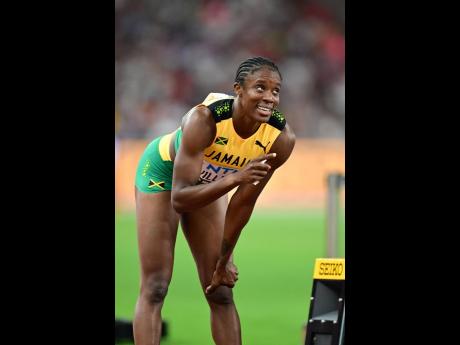 Jamaica’s Danielle Williams gives an approving smile after capturing the women’s 100 metres hurdles.